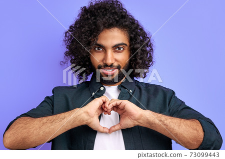 handsome arabic man show heart made from hands at camera handsome arabic man show heart made from hands at camera 73099443