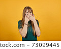 Covering mouth with palm. Can't say anything. Shocked gasping amazed stunning 73099445