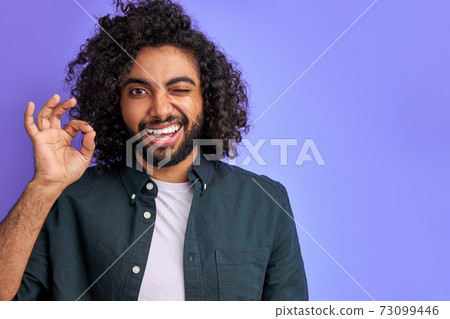 everything will be OK. curly arabic male show ok gesture everything will be OK. curly arabic male show ok gesture 73099446
