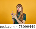 Hand points index finger up, pointing forefinger surprise gift option, idea. 73099449