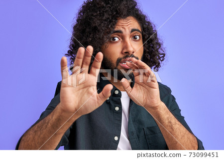 young arab man is terrified with fear expression stop gesture with hands 73099451