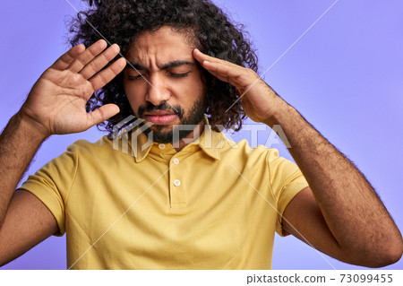 exhausted man is tired to endure the pain exhausted man is tired to endure the pain 73099455