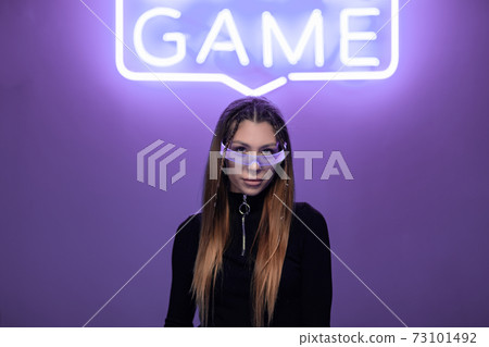 Young woman in cyber neon glasses. Cyberpunk style 73101492