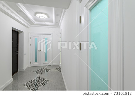 interior of white hallway with doors interior of white hallway with doors 73101812