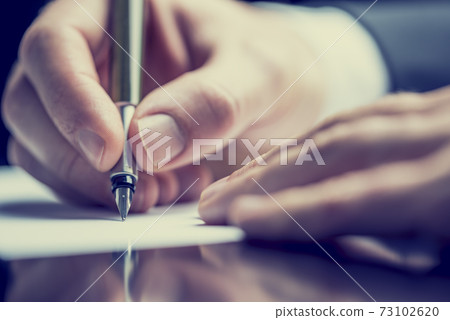 Retro image of a man writing a note 73102620