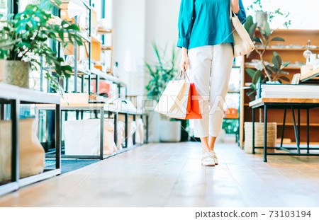 Young woman shopping Young woman shopping 73103194