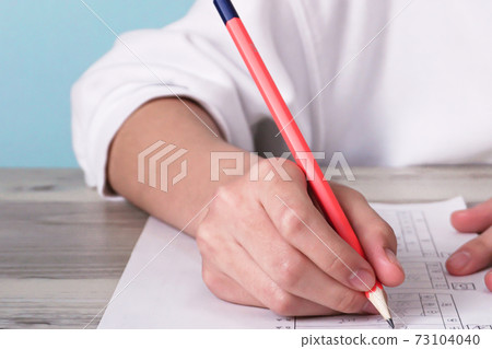 The hand of the person who solves the problem. Tests, exams, education, etc. The hand of the person who solves the problem. Tests, exams, education, etc. 73104040