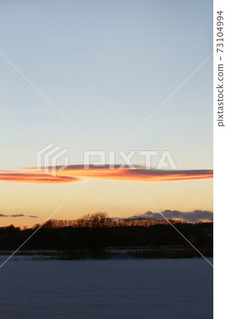 Winter sunset sky 73104994