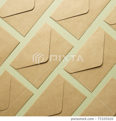 Kraft brown paper envelopes on khaki background. top view, copy space Kraft brown paper envelopes on khaki background. top view, copy space 73105020