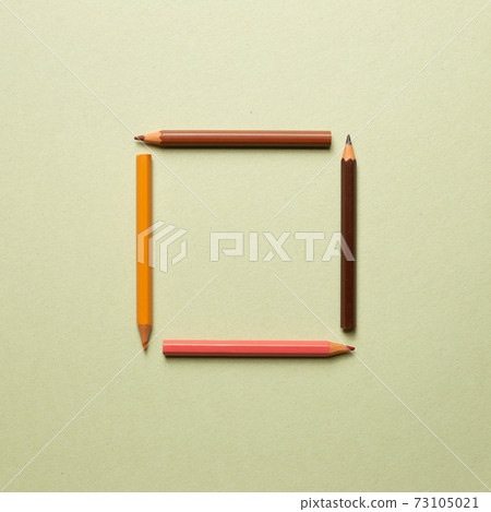 Colored pencils on khaki background. flat lay, top view, copy space Colored pencils on khaki background. flat lay, top view, copy space 73105021