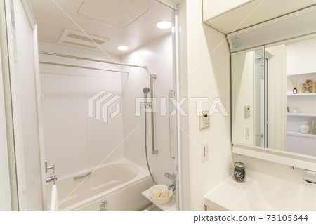 Clean bathroom and wash basin in a new condominium 73105844