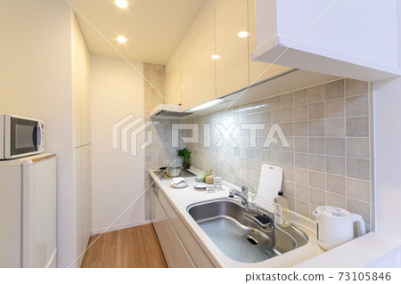 Image of fashionable kitchen space in a newly built condominium Image of fashionable kitchen space in a newly built condominium 73105846