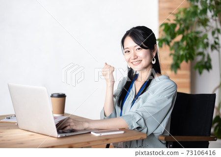 Business woman guts pose in the office Business woman guts pose in the office 73106416