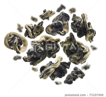 Dried Oolong tea levitates on a white background 73107494
