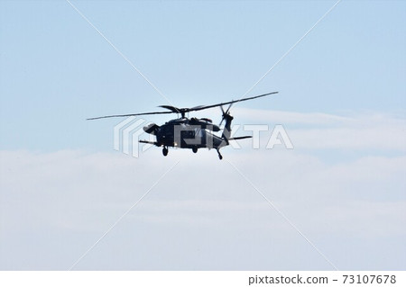 UH-60J rescue helicopter of the Air Self-Defense Force flying in the sky UH-60J rescue helicopter of the Air Self-Defense Force flying in the sky 73107678