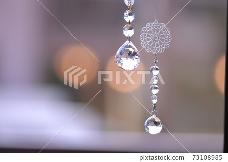 Suncatcher hung by the window 73108985