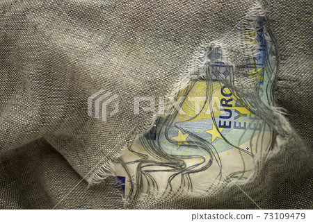 Euro bill viewed through a hole Euro bill viewed through a hole 73109479