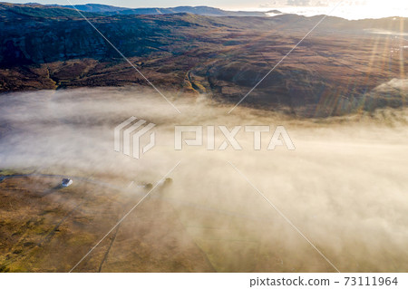 Donegal covered with fog from Crove upper to Teelin - Ireland Donegal covered with fog from Crove upper to Teelin - Ireland 73111964