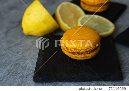 yellow lemon macaroni cookies on a gray background 73116069
