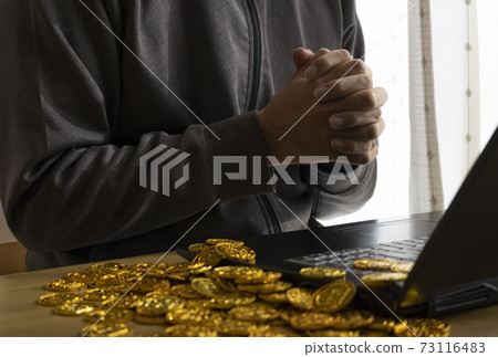 Image of a man making money from cybercrime Image of a man making money from cybercrime 73116483