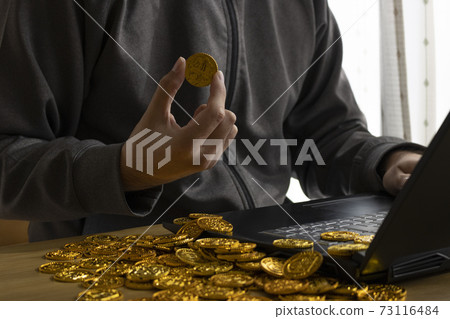 Image of a man making money from cybercrime Image of a man making money from cybercrime 73116484