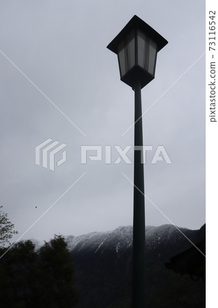 Lamp on a snowy day 73116542