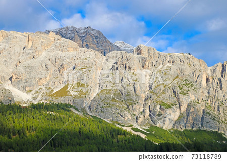 Beautiful Dolomites in Italy. Clear day with blue sky. Mountains are illuminated by the rays of the sun. Clean fresh air. Selective focus. 73118789