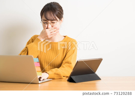 A young woman who has a runny nose due to hay fever A young woman who has a runny nose due to hay fever 73120288