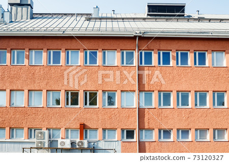 Facade of a building with rows of windows Facade of a building with rows of windows 73120327