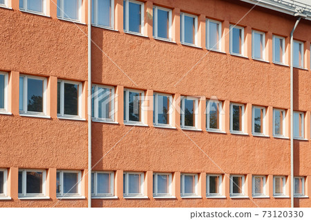 Facade of a building with rows of windows Facade of a building with rows of windows 73120330