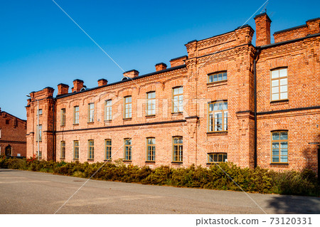 Beautiful vintage red brick building at sunny day Beautiful vintage red brick building at sunny day 73120331