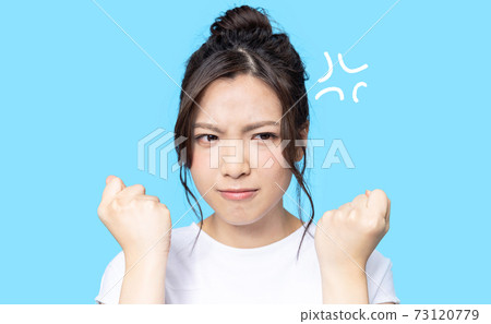 Frustrated woman with an angry expression Frustrated woman with an angry expression 73120779