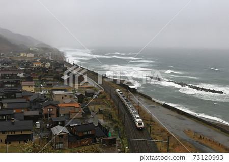 Limited express "Shirayuki" running on the Shin-Etsu main line in winter Limited express "Shirayuki" running on the Shin-Etsu main line in winter 73120993