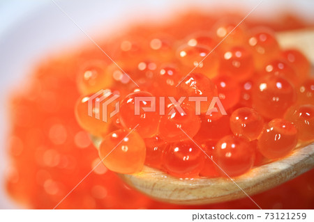 Salmon roe scooped with a spoon Salmon roe scooped with a spoon 73121259