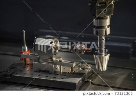 The sinker EDM machine operation. The sinker EDM machine operation. 73121365