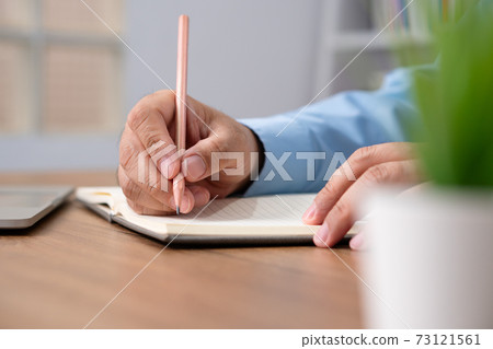 Asian Businessman Writing a business plan After looking at the annual profit and loss summary report. The concept of Business success Needs to be analyzed And management planning. Asian Businessman Writing a business plan After looking at the annual profit and loss summary report. The concept of Business success Needs to be analyzed And management planning. 73121561