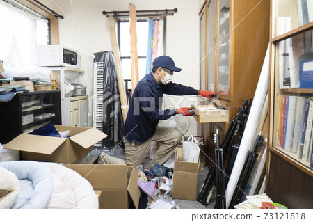 Workers cleaning up cluttered rooms Workers cleaning up cluttered rooms 73121818
