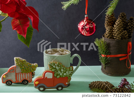 Iced tea, New Year's gingerbread, spruce branches and cones. 73122842