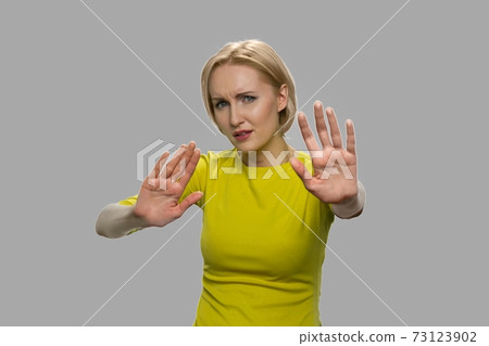 Young caucasian woman showing rejection sign. Young caucasian woman showing rejection sign. 73123902