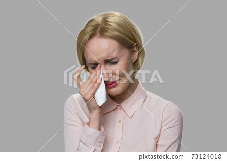 Close up upset young woman is crying. 73124018