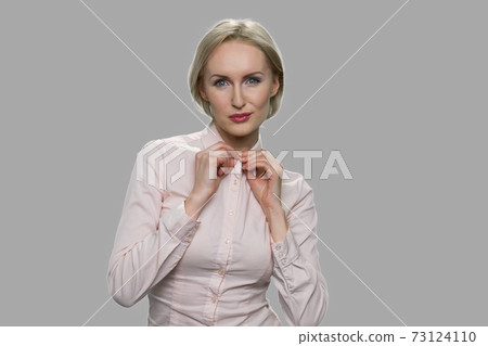 Pretty business lady is expressing her sexuality. Pretty business lady is expressing her sexuality. 73124110