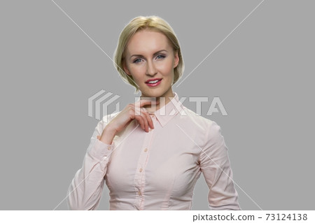 Portrait of beautiful woman looking at camera. Portrait of beautiful woman looking at camera. 73124138