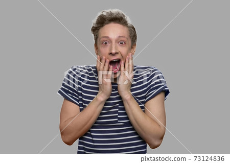 Happy stunned teen boy close up. Happy stunned teen boy close up. 73124836