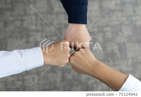 Fist collision of the three businessmen congratulating on working together, Fists collide, Business people cooperation and Partnership Business Concept. Fist collision of the three businessmen congratulating on working together, Fists collide, Business people cooperation and Partnership Business Concept. 73124942