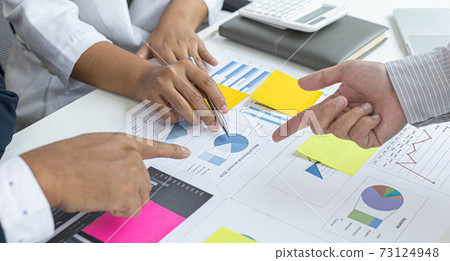 Business team meeting and presentation of works, Marketing department and data analysts propose ideas for driving sales strategies using graphs and charts, Brainstorming of business people. Business team meeting and presentation of works, Marketing department and data analysts propose ideas for driving sales strategies using graphs and charts, Brainstorming of business people. 73124948