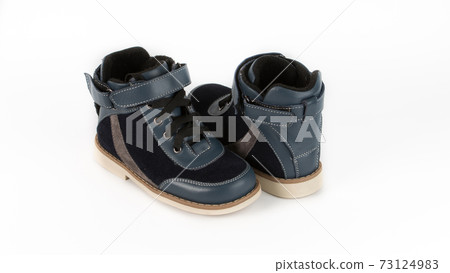 children's blue orthopedic shoes on a white background children's blue orthopedic shoes on a white background 73124983