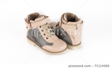 children's beige high orthopedic lacing shoes on a white background children's beige high orthopedic lacing shoes on a white background 73124989