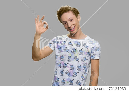 Cute teen boy giving ok symbol. Cute teen boy giving ok symbol. 73125083