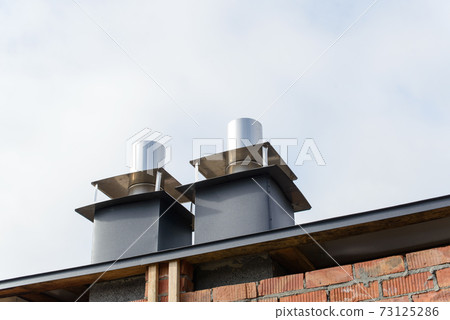 unfinished roof of a multi-storey building. Construction works. unfinished roof of a multi-storey building. Construction works. 73125286