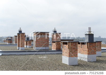 unfinished roof of a multi-storey building. Construction works. 73125288